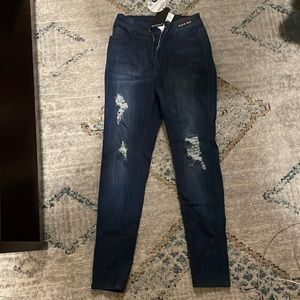 Size 9, Fashion nova dark denim ankle jeans with rips. Never worn with tags.